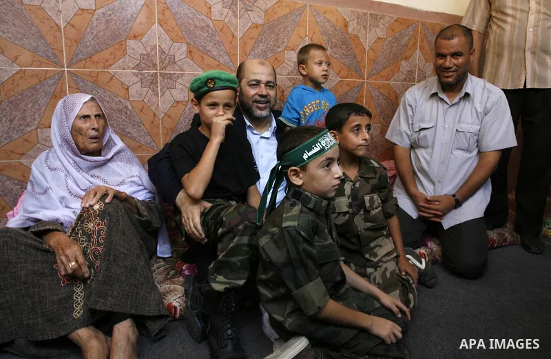 Senior Hamas official, Moussa Abu Marzouk visits the family of Raed Al-Attar in Rafah in southern Gaza strip on August 28, 2014. An open-ended ceasefire in the Gaza war held on Wednesday as Prime Minister Benjamin Netany...