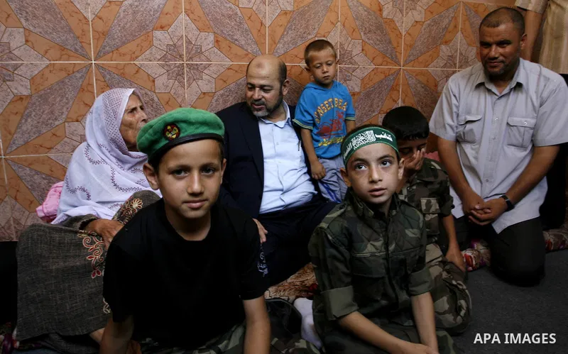 Senior Hamas official, Moussa Abu Marzouk speaks to mother of Raed Al-Attar during visit her in Rafah in southern Gaza strip on August 28, 2014. An open-ended ceasefire in the Gaza war held on Wednesday as Prime Minister...
