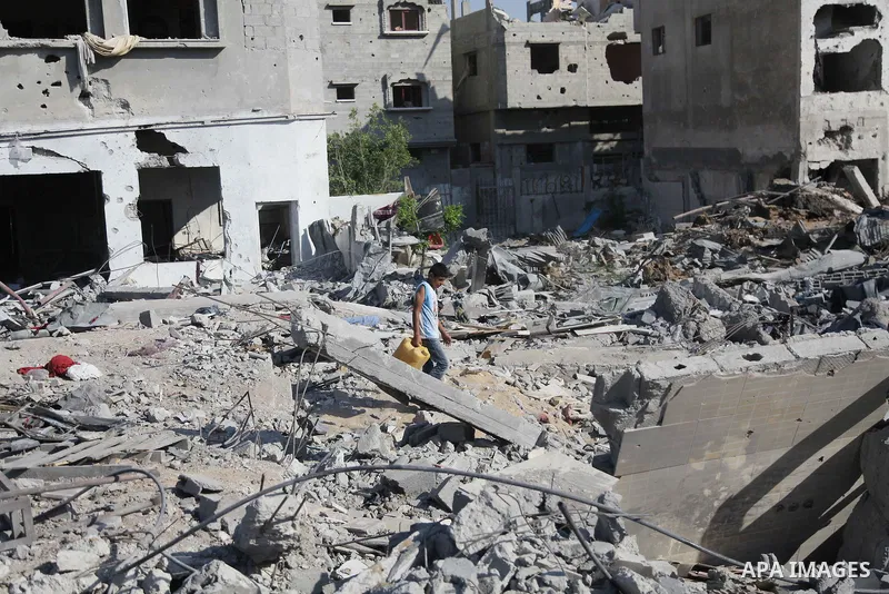 Palestinians return to their houses in Shejaiya neighborhood after a ceasefire was declared, in Gaza city on August 28, 2014. Israel and Palestinians both boasted of victory in the Gaza war but analysts say Hamas receive...