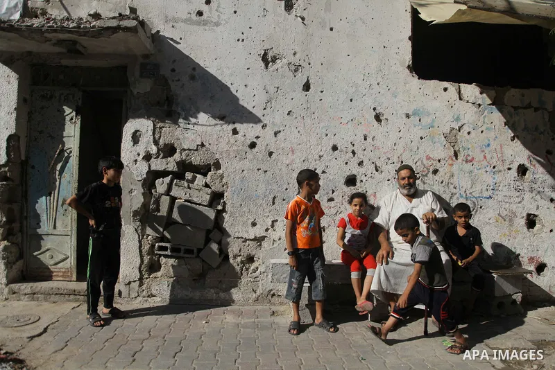 Palestinians return to their houses in Shejaiya neighborhood after a ceasefire was declared, in Gaza city on August 28, 2014. Israel and Palestinians both boasted of victory in the Gaza war but analysts say Hamas receive...
