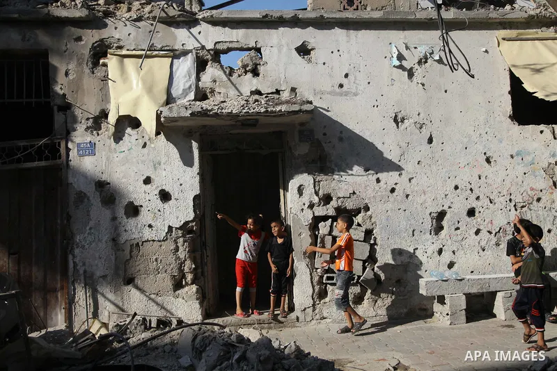 Palestinians return to their houses in Shejaiya neighborhood after a ceasefire was declared, in Gaza city on August 28, 2014. Israel and Palestinians both boasted of victory in the Gaza war but analysts say Hamas receive...