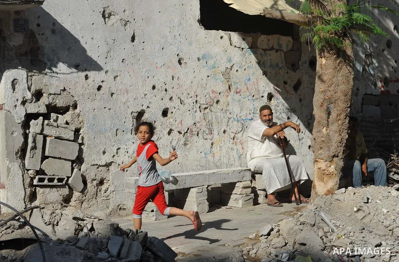 Palestinians return to their houses in Shejaiya neighborhood after a ceasefire was declared, in Gaza city on August 28, 2014. Israel and Palestinians both boasted of victory in the Gaza war but analysts say Hamas receive...