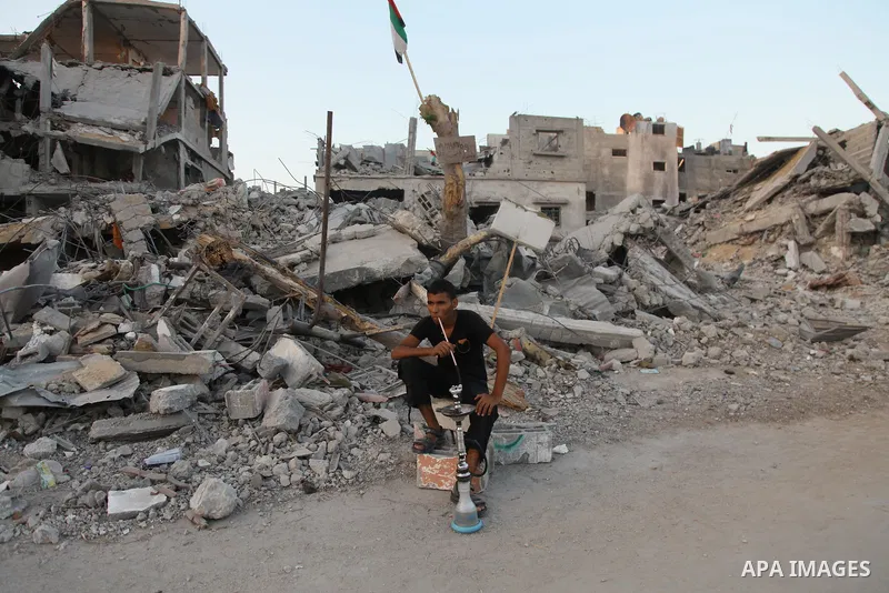Palestinians return to their houses in Beit Hanoun after a ceasefire was declared, in northern Gaza strip on August 28, 2014. Israel and Palestinians both boasted of victory in the Gaza war but analysts say Hamas receive...