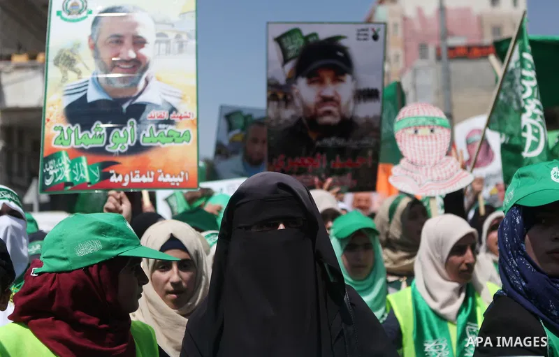 Palestinian supporters of the Hamas Islamist movement take part in a rally following the Friday prayers, three days after a deal hailed by Israel and Hamas as 'victory' in the 50-day war on August 29, 2014 in the West Ba...