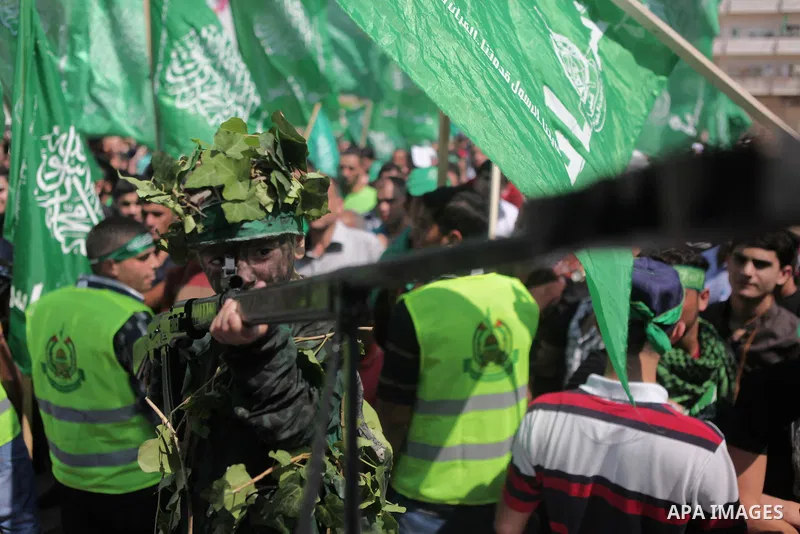 Palestinian boys hold a mock rocket during a rally following the Friday prayers, three days after a deal hailed by Israel and Hamas as 'victory' in the 50-day war on August 29, 2014 in the West Bank town of Hebron. Thous...