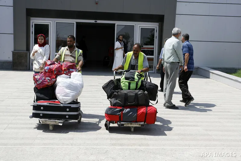 Palestinians wait to be given the permission to cross into Egypt at the Rafah border crossing in the southern Gaza Strip, on August 28, 2014. The Rafah crossing with Egypt is Gaza's only gateway to the world that is not...