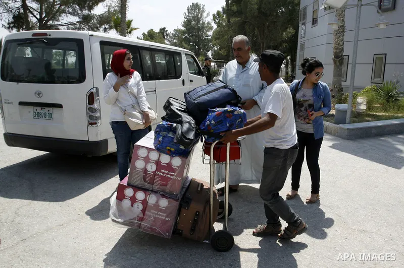 Palestinians wait to be given the permission to cross into Egypt at the Rafah border crossing in the southern Gaza Strip, on August 28, 2014. The Rafah crossing with Egypt is Gaza's only gateway to the world that is not...