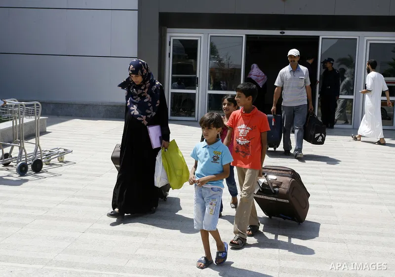 Palestinians wait to be given the permission to cross into Egypt at the Rafah border crossing in the southern Gaza Strip, on August 28, 2014. The Rafah crossing with Egypt is Gaza's only gateway to the world that is not...