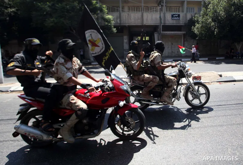 Palestinian Islamic Jihad militants take part in a rally celebrating what they say was a victory over Israel following a ceasefire in Gaza City August 29, 2014. An open-ended ceasefire, mediated by Egypt, took effect on...