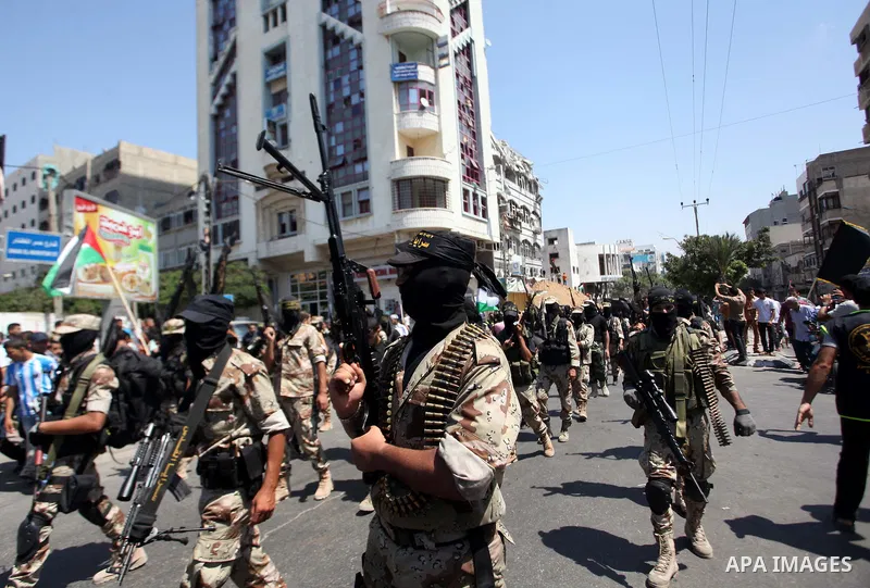 Palestinian Islamic Jihad militants take part in a rally celebrating what they say was a victory over Israel following a ceasefire in Gaza City August 29, 2014. An open-ended ceasefire, mediated by Egypt, took effect on...