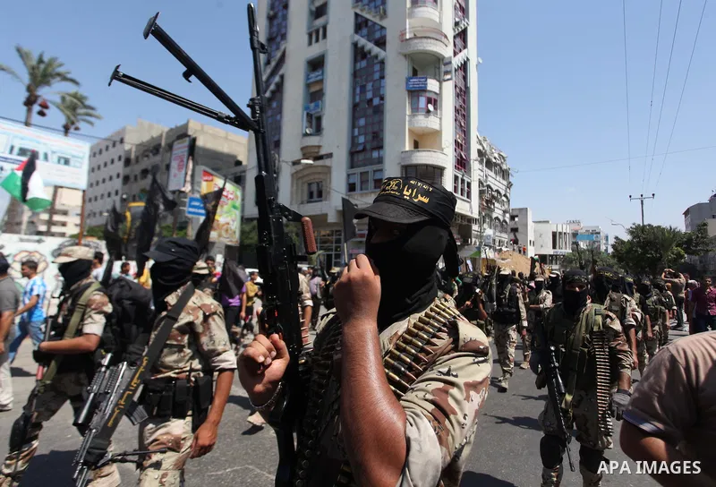 Palestinian Islamic Jihad militants take part in a rally celebrating what they say was a victory over Israel following a ceasefire in Gaza City August 29, 2014. An open-ended ceasefire, mediated by Egypt, took effect on...