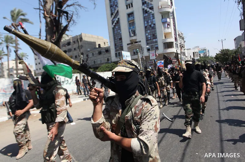 Palestinian Islamic Jihad militants take part in a rally celebrating what they say was a victory over Israel following a ceasefire in Gaza City August 29, 2014. An open-ended ceasefire, mediated by Egypt, took effect on...