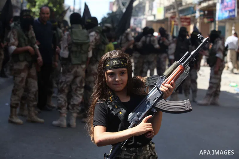 A Palestinian girl takes part in a rally celebrating what they say was a victory over Israel following a ceasefire in Gaza City August 29, 2014. An open-ended ceasefire, mediated by Egypt, took effect on Tuesday evening....