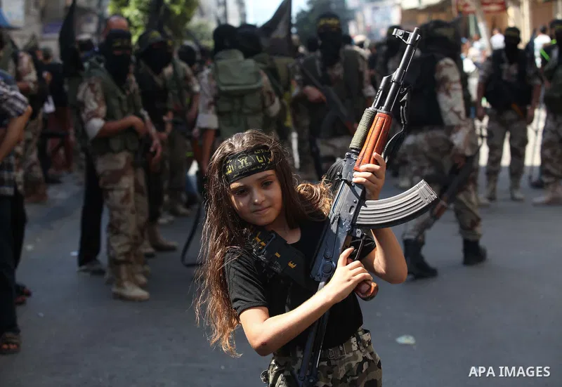 A Palestinian girl takes part in a rally celebrating what they say was a victory over Israel following a ceasefire in Gaza City August 29, 2014. An open-ended ceasefire, mediated by Egypt, took effect on Tuesday evening....