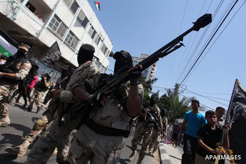 Palestinian Islamic Jihad supporters celebrate with people what they said was a victory over Israel, in Gaza City August 29, 2014. An open-ended ceasefire, mediated by Egypt, took effect on Tuesday evening. It called for...