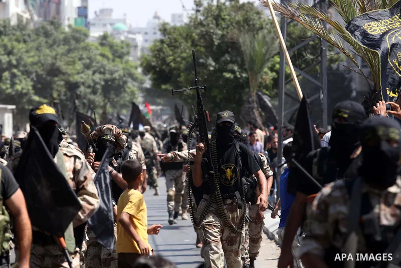 Palestinian Islamic Jihad supporters celebrate with people what they said was a victory over Israel, in Gaza City August 29, 2014. An open-ended ceasefire, mediated by Egypt, took effect on Tuesday evening. It called for...