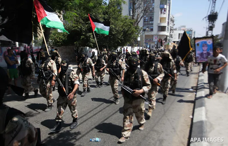 Palestinian Islamic Jihad supporters celebrate with people what they said was a victory over Israel, in Gaza City August 29, 2014. An open-ended ceasefire, mediated by Egypt, took effect on Tuesday evening. It called for...