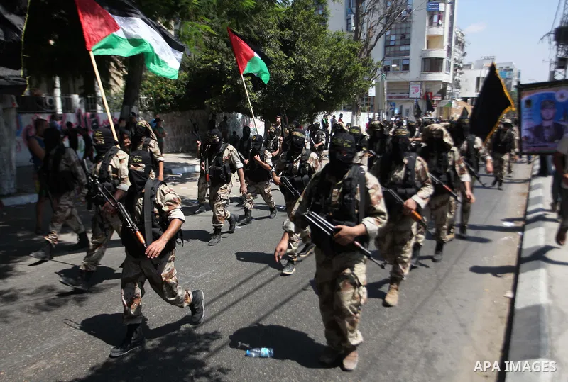 Palestinian Islamic Jihad supporters celebrate with people what they said was a victory over Israel, in Gaza City August 29, 2014. An open-ended ceasefire, mediated by Egypt, took effect on Tuesday evening. It called for...