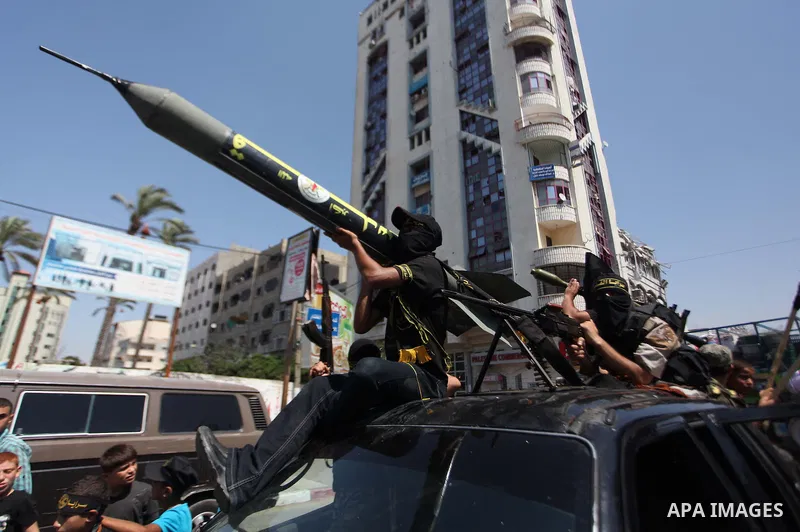 Palestinian Islamic Jihad supporters celebrate with people what they said was a victory over Israel, in Gaza City August 29, 2014. An open-ended ceasefire, mediated by Egypt, took effect on Tuesday evening. It called for...