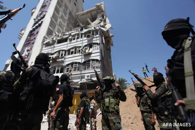 Palestinian Islamic Jihad supporters celebrate with people what they said was a victory over Israel, in Gaza City August 29, 2014. An open-ended ceasefire, mediated by Egypt, took effect on Tuesday evening. It called for...