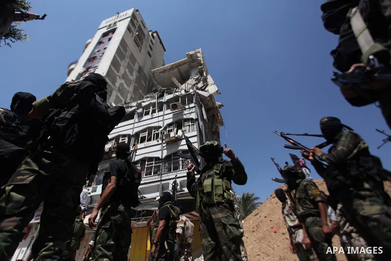 Palestinian Islamic Jihad supporters celebrate with people what they said was a victory over Israel, in Gaza City August 29, 2014. An open-ended ceasefire, mediated by Egypt, took effect on Tuesday evening. It called for...