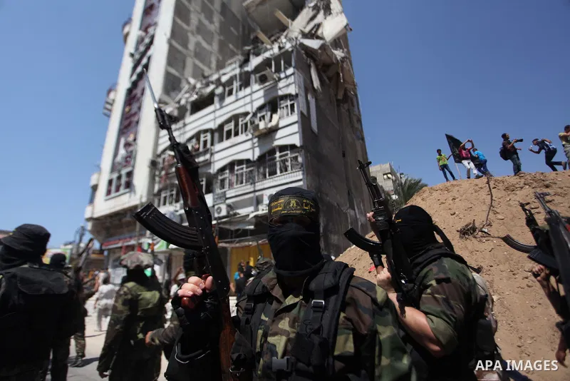 Palestinian Islamic Jihad supporters celebrate with people what they said was a victory over Israel, in Gaza City August 29, 2014. An open-ended ceasefire, mediated by Egypt, took effect on Tuesday evening. It called for...