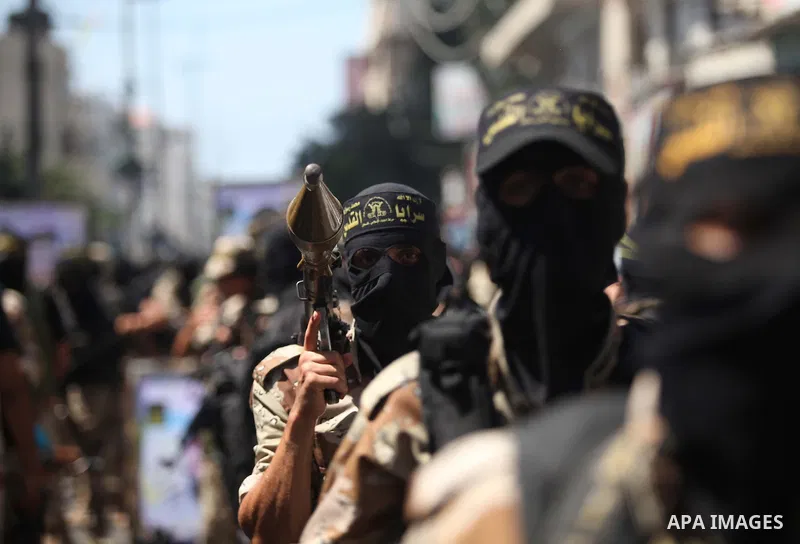 Palestinian Islamic Jihad supporters celebrate with people what they said was a victory over Israel, in Gaza City August 29, 2014. An open-ended ceasefire, mediated by Egypt, took effect on Tuesday evening. It called for...