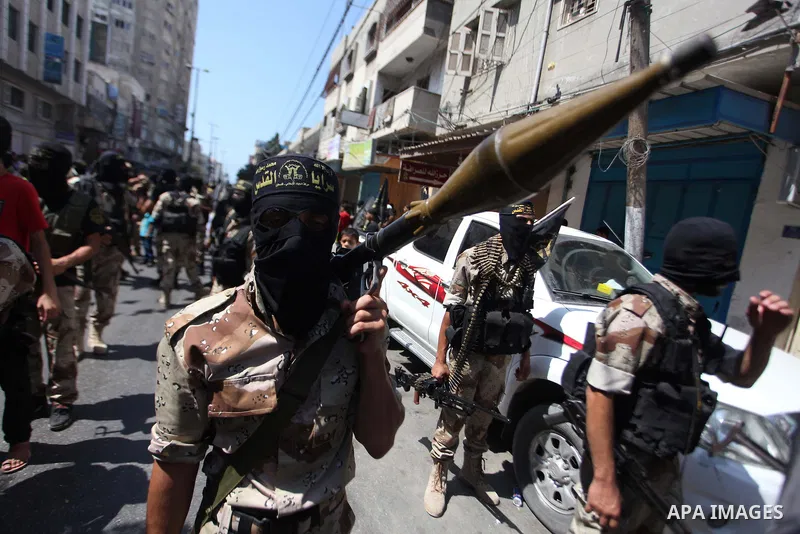 Palestinian Islamic Jihad supporters celebrate with people what they said was a victory over Israel, in Gaza City August 29, 2014. An open-ended ceasefire, mediated by Egypt, took effect on Tuesday evening. It called for...