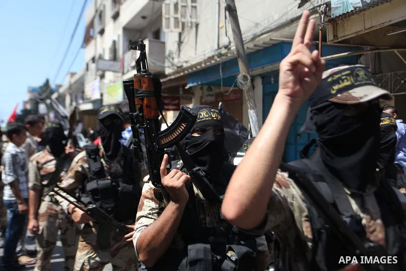 Palestinian Islamic Jihad supporters celebrate with people what they said was a victory over Israel, in Gaza City August 29, 2014. An open-ended ceasefire, mediated by Egypt, took effect on Tuesday evening. It called for...