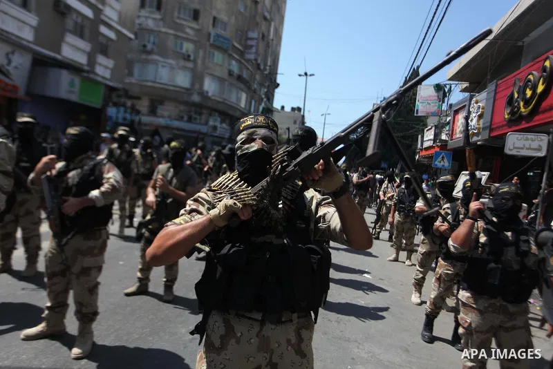 Palestinian Islamic Jihad supporters celebrate with people what they said was a victory over Israel, in Gaza City August 29, 2014. An open-ended ceasefire, mediated by Egypt, took effect on Tuesday evening. It called for...