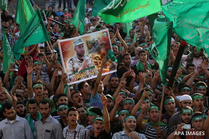 Palestinians who support the Islamic Hamas movement take part in a rally showing their support and solidarity with Hamas in the West Bank city of Nablus, 29 August 2014. An open-ended ceasefire, mediated by Egypt, took e...