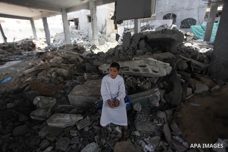 Palestinians perform Friday prayers at the remains of a mosque, which witnesses said was hit by an Israeli air strike during a seven-week Israeli offensive in Gaza City August 29, 2014. An open-ended ceasefire, mediated...