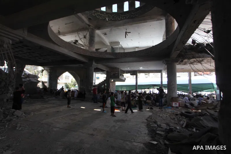 Palestinians perform Friday prayers at the remains of a mosque, which witnesses said was hit by an Israeli air strike during a seven-week Israeli offensive in Gaza City August 29, 2014. An open-ended ceasefire, mediated...