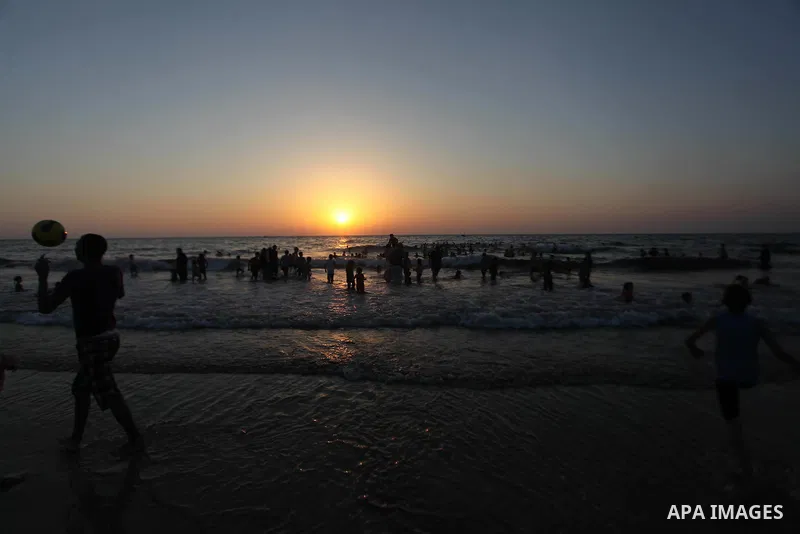 Palestinians play in the Mediterranean Sea off the coast of Gaza City August 29, 2014, days after a ceasefire was reached. An open-ended ceasefire, mediated by Egypt, took effect on Tuesday evening. It called for an inde...