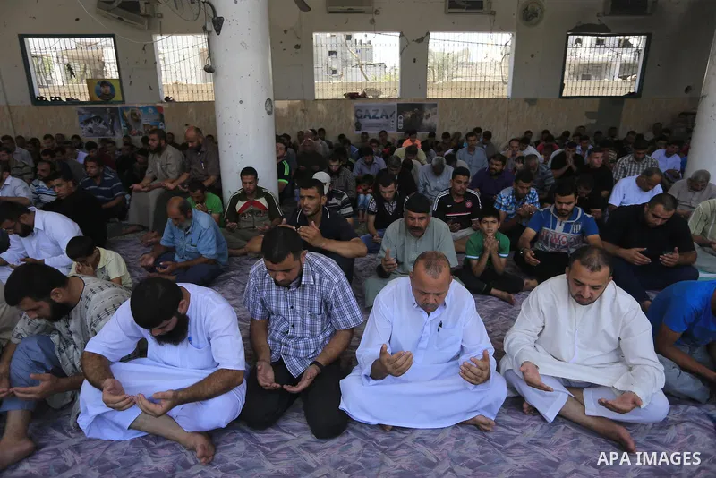 Palestinians perform Friday prayers at the remains of a mosque, which witnesses said was hit by an Israeli air strike during a seven-week Israeli offensive in Gaza City August 29, 2014. An open-ended ceasefire, mediated...