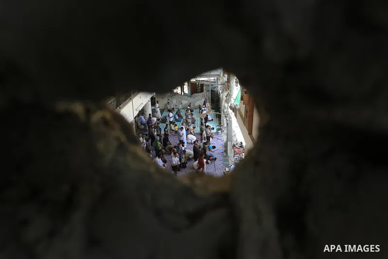 Palestinians perform Friday prayers at the remains of a mosque, which witnesses said was hit by an Israeli air strike during a seven-week Israeli offensive in Gaza City August 29, 2014. An open-ended ceasefire, mediated...