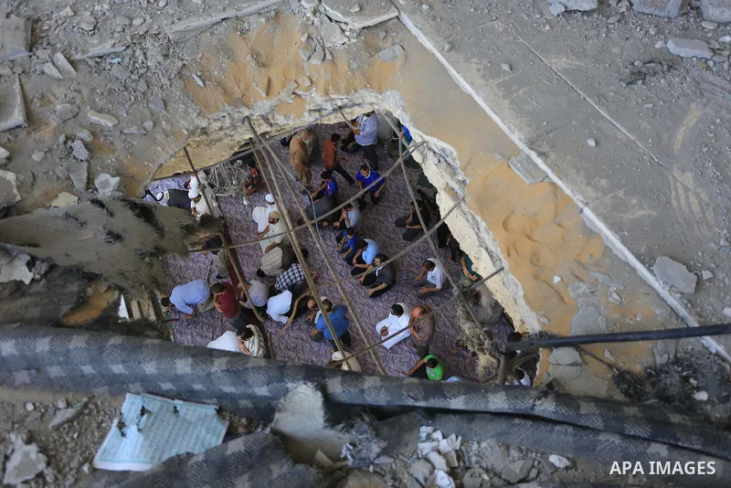 Palestinians perform Friday prayers at the remains of a mosque, which witnesses said was hit by an Israeli air strike during a seven-week Israeli offensive in Gaza City August 29, 2014. An open-ended ceasefire, mediated...