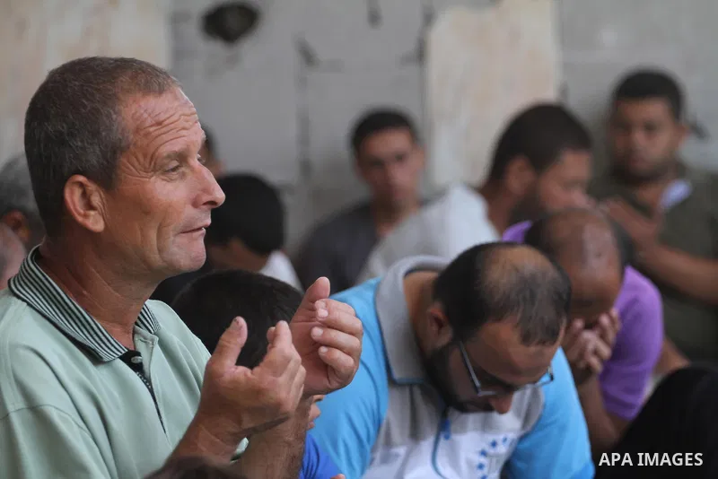 Palestinians perform Friday prayers at the remains of a mosque, which witnesses said was hit by an Israeli air strike during a seven-week Israeli offensive in Gaza City August 29, 2014. An open-ended ceasefire, mediated...