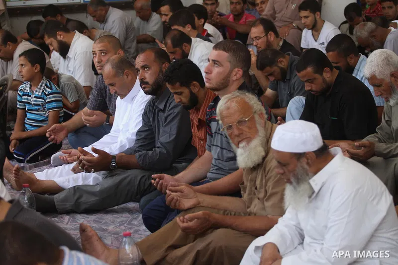Palestinians perform Friday prayers at the remains of a mosque, which witnesses said was hit by an Israeli air strike during a seven-week Israeli offensive in Gaza City August 29, 2014. An open-ended ceasefire, mediated...