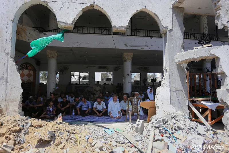 Palestinians perform Friday prayers at the remains of a mosque, which witnesses said was hit by an Israeli air strike during a seven-week Israeli offensive in Gaza City August 29, 2014. An open-ended ceasefire, mediated...