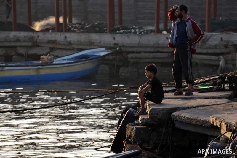 Palestinian fishing boats are moored at Gaza's seaport in Gaza City early on August 29, 2014. Israel and Hamas accepted an Egyptian proposal for a long-term ceasefire in war-torn Gaza on August 26 in a move to end 50 day...
