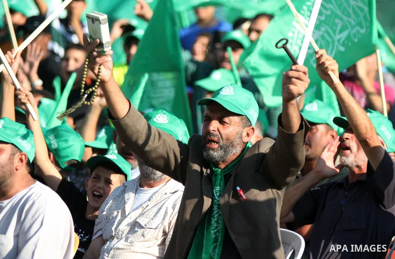 Palestinians who support the Islamic Hamas movement celebrate what they said was a victory by Palestinians in Gaza over Israel following a ceasefire, in the West Bank city of Ramallah August 30, 2014. An open-ended cease...