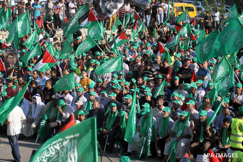 Palestinians who support the Islamic Hamas movement celebrate what they said was a victory by Palestinians in Gaza over Israel following a ceasefire, in the West Bank city of Ramallah August 30, 2014. An open-ended cease...