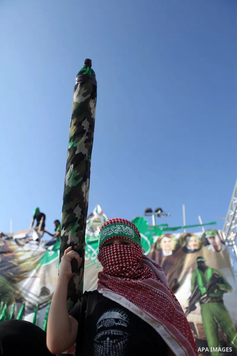 A masked Palestinian boy holds a mock rocket during a celebrate in a victory by Palestinians in Gaza over Israel following a ceasefire, in the West Bank city of Ramallah August 30, 2014. An open-ended ceasefire, mediated...
