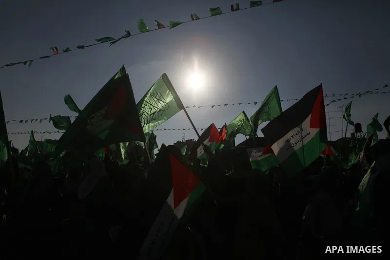 Palestinians who support the Islamic Hamas movement celebrate what they said was a victory by Palestinians in Gaza over Israel following a ceasefire, in the West Bank city of Ramallah August 30, 2014. An open-ended cease...