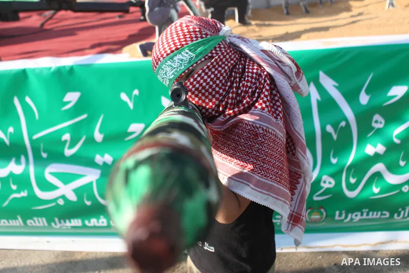 A masked Palestinian boy holds a mock rocket during a celebrate in a victory by Palestinians in Gaza over Israel following a ceasefire, in the West Bank city of Ramallah August 30, 2014. An open-ended ceasefire, mediated...