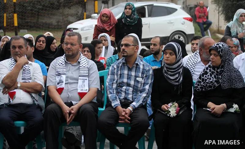 Palestinian Journalists's families take part in a ceremony honoring in Gaza city on 30 August 2014. An indefinite ceasefire to end seven weeks of fighting between Israel and Palestinian militant groups in the Gaza Strip...