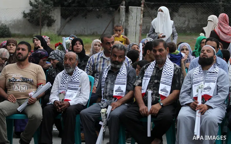 Palestinian Journalists's families take part in a ceremony honoring in Gaza city on 30 August 2014. An indefinite ceasefire to end seven weeks of fighting between Israel and Palestinian militant groups in the Gaza Strip...