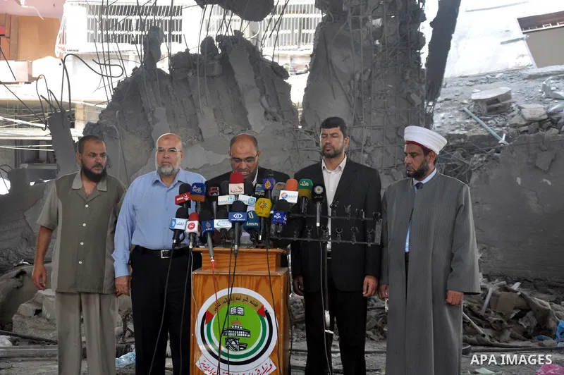 Palestinian Undersecretary of Minister of Awqaf and Religious Affairs, Hassan El-Safi, speaks during a Press conference, in Gaza city on Aug. 31, 2014. Photo by Mohammed Talatene