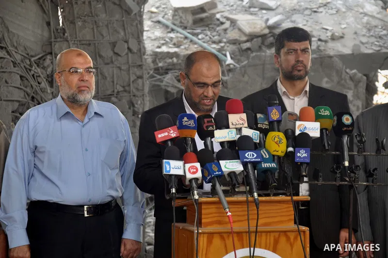 Palestinian Undersecretary of Minister of Awqaf and Religious Affairs, Hassan El-Safi, speaks during a Press conference, in Gaza city on Aug. 31, 2014. Photo by Mohammed Talatene
